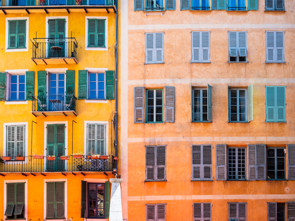 yellow concrete building with windows