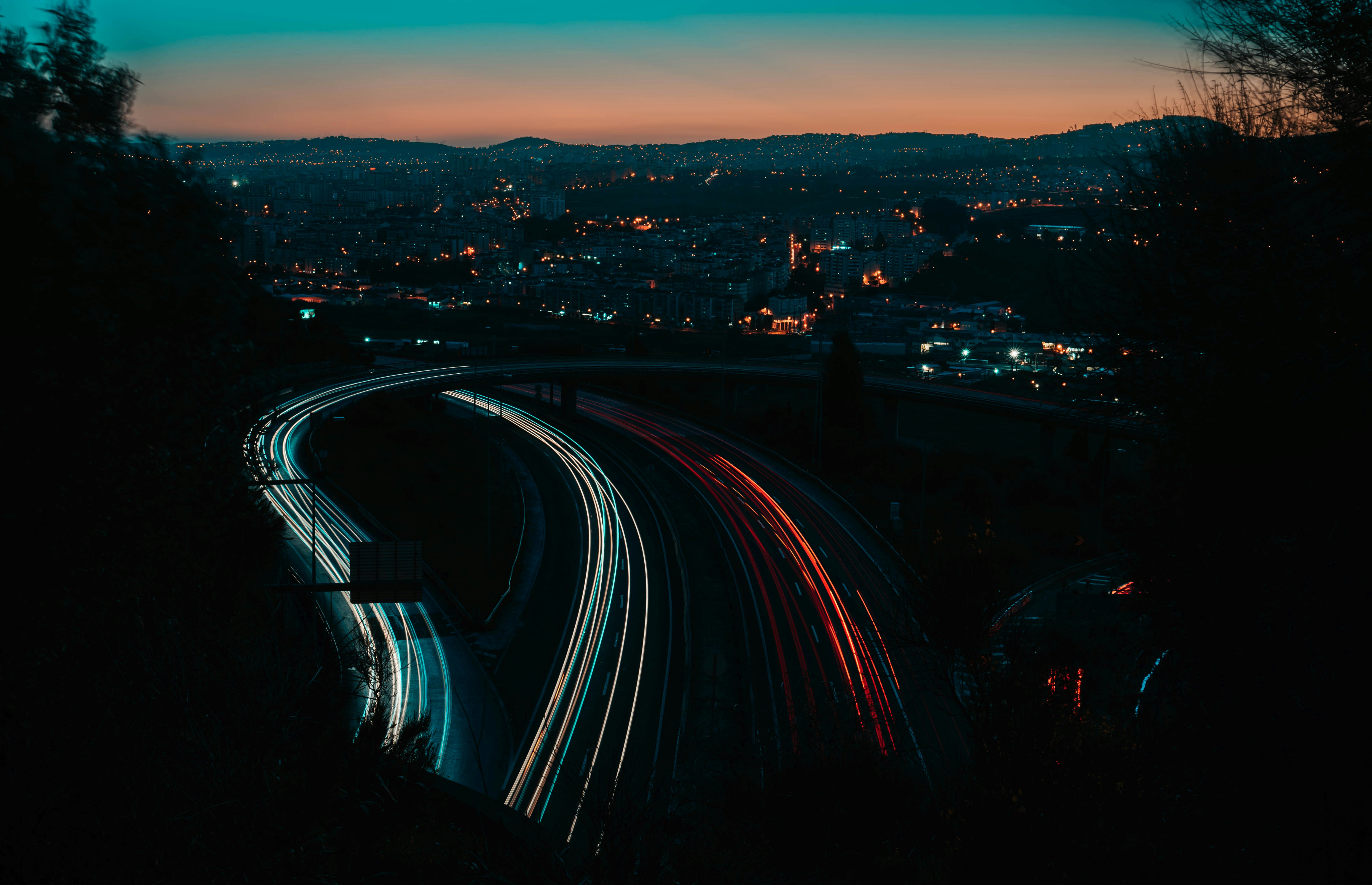 time lapse photography of vehicles passing on roads, 