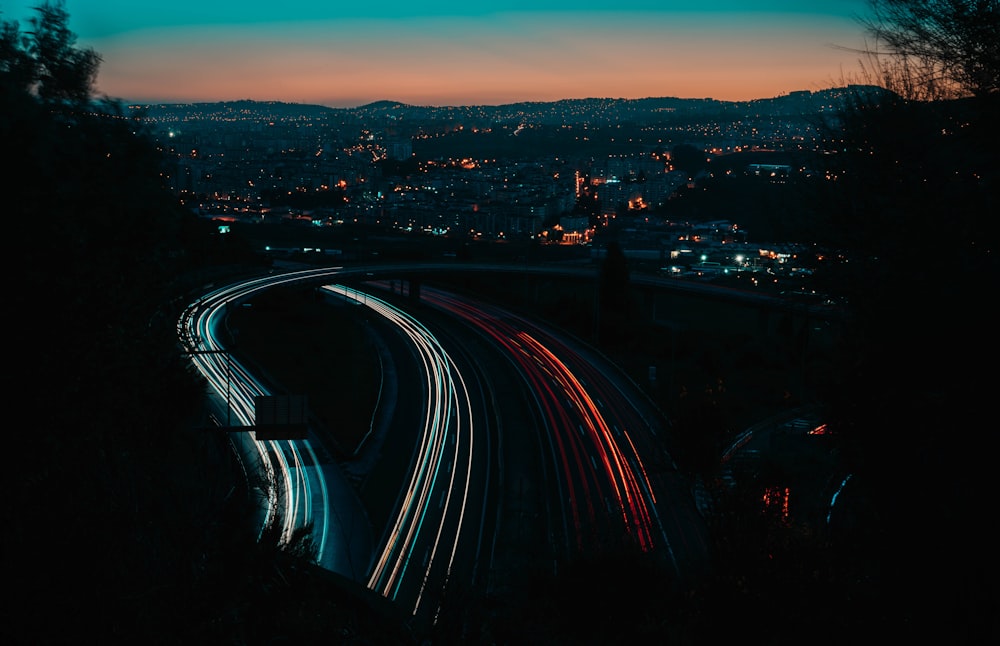 time lapse photography of vehicles passing on roads