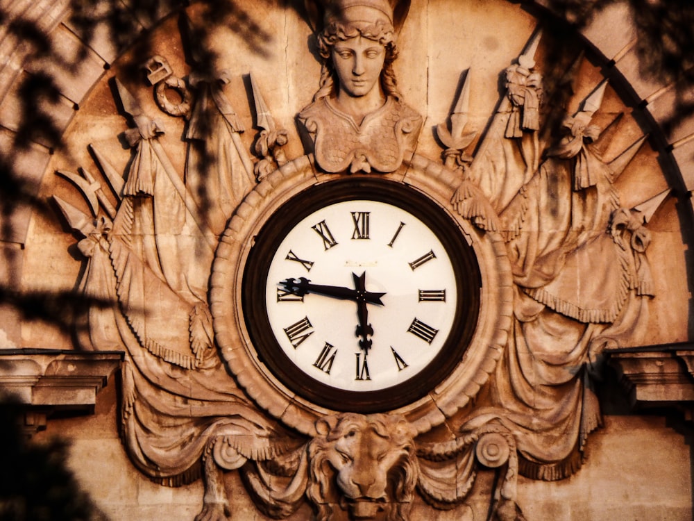 roman analog clock displaying at 5:46