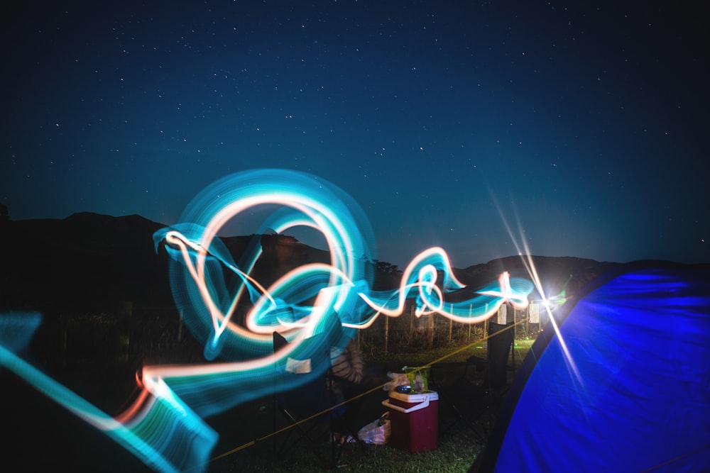 blue and white LED lights above green field