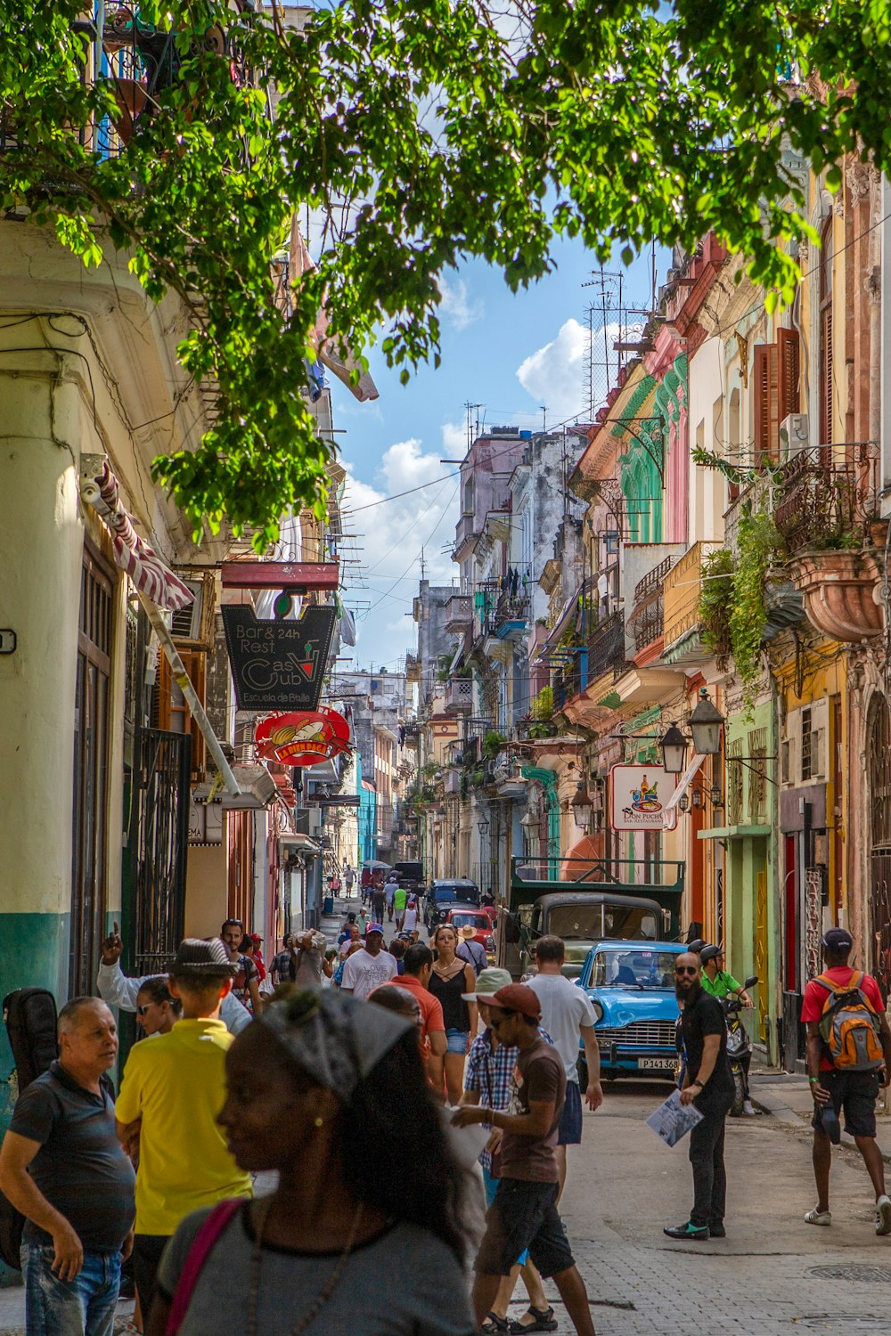 urban photo of a brick road with groups of people