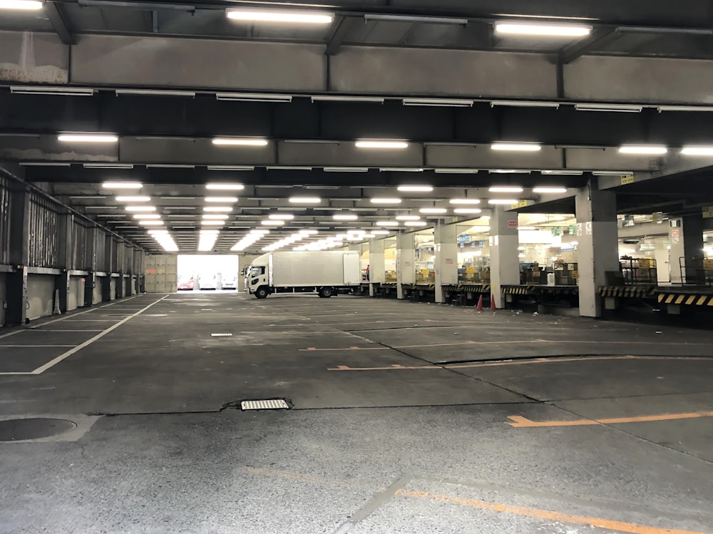 white and grey panel truck parked in basement parking