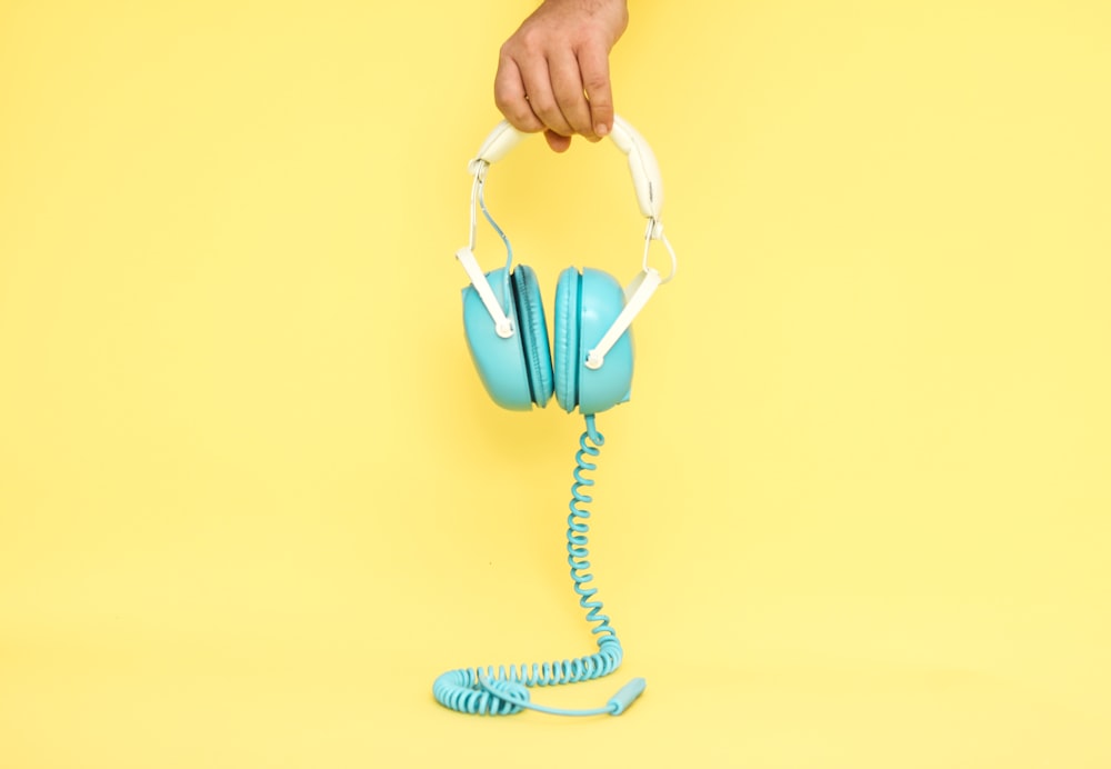 white and blue corded earmuffs