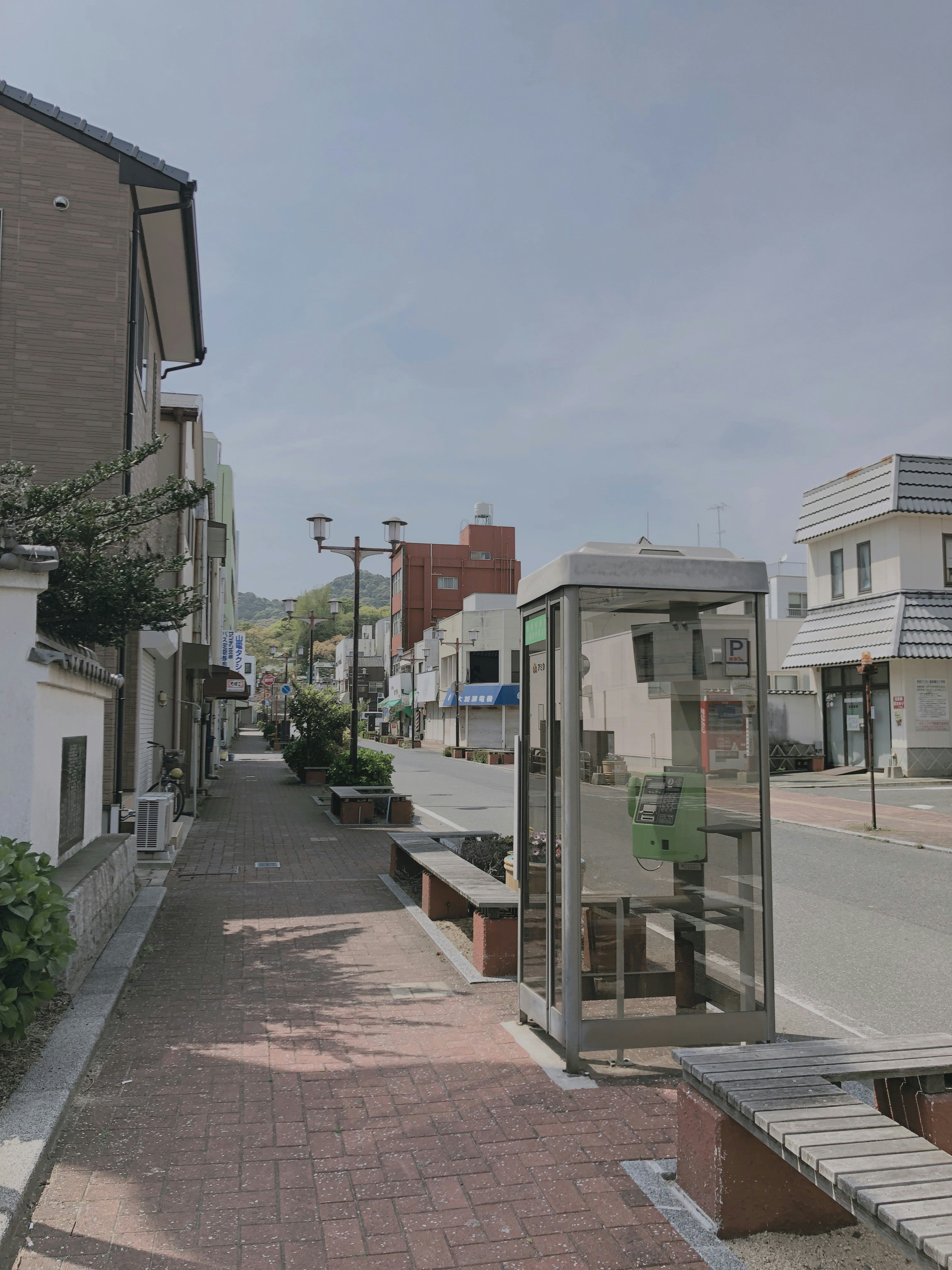 telephone booth beside road