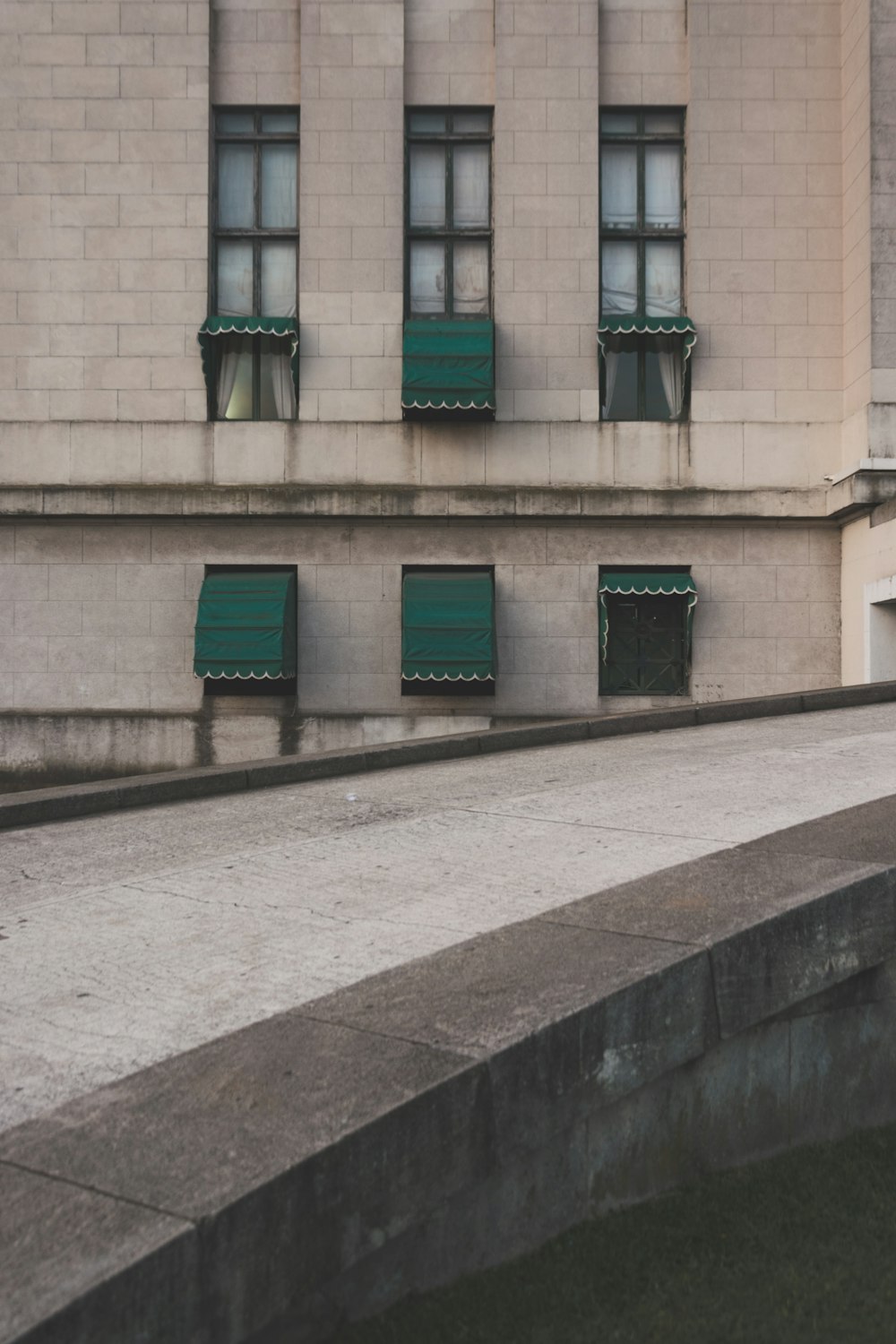 white concrete building near pathway