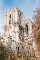 Notre Dame in Paris under blue and white skies