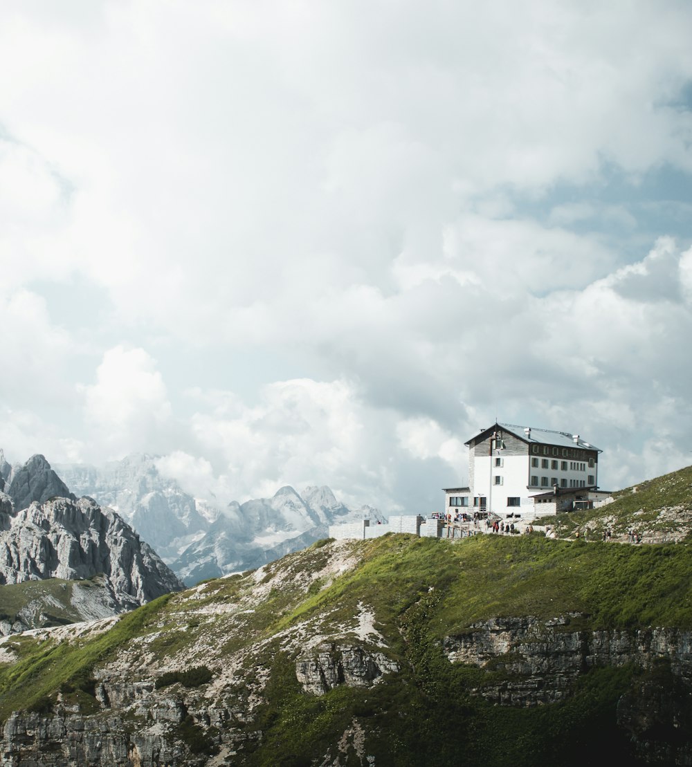 white and black concrete house on a mountain top