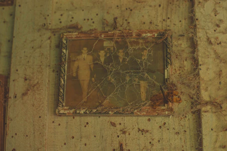 A restored vintage family photo next to the original damaged print.