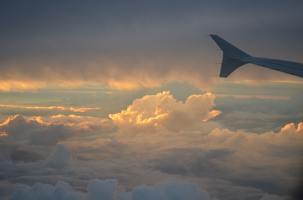 a view of the wing of an airplane in the sky