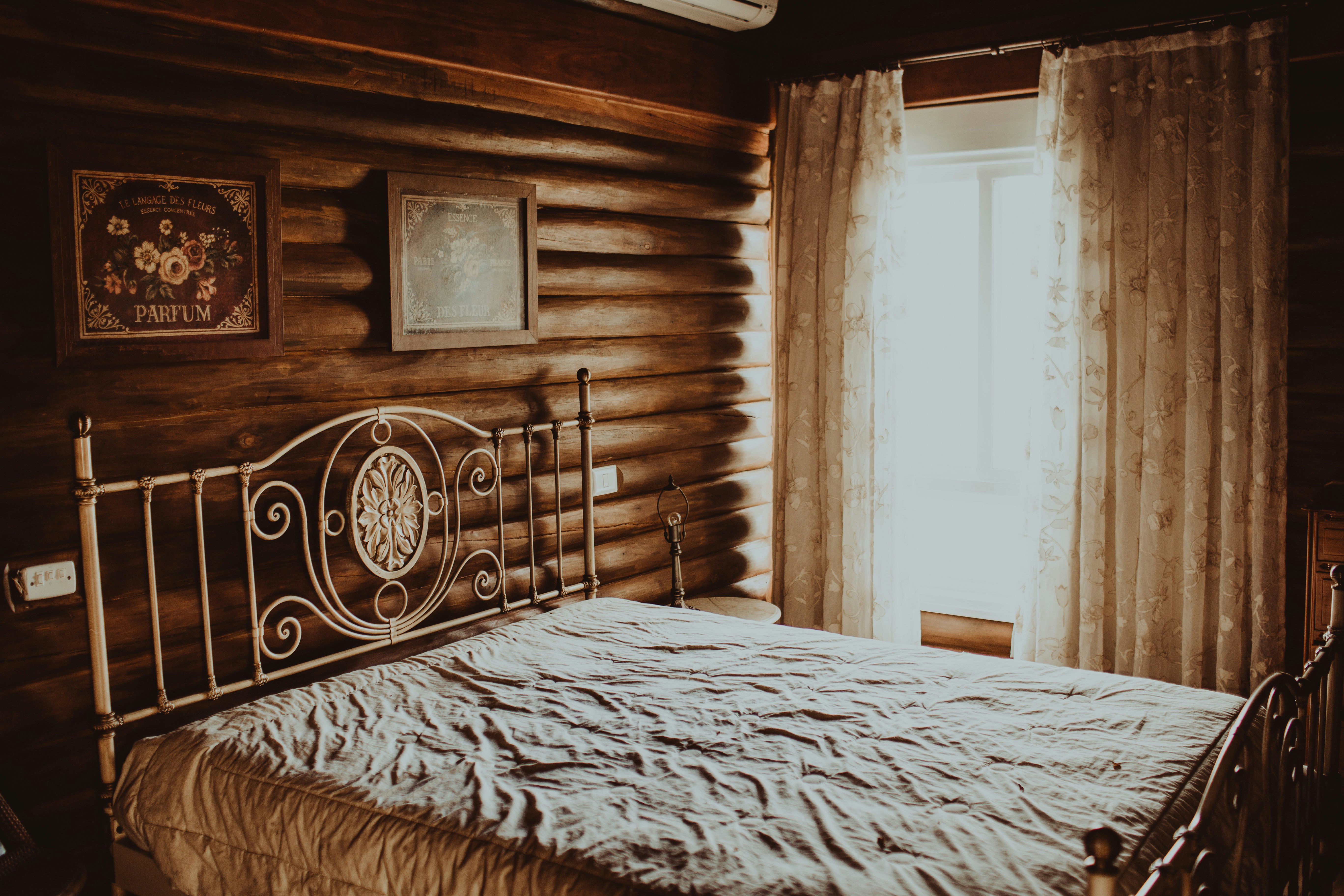 Bed inside rustic room