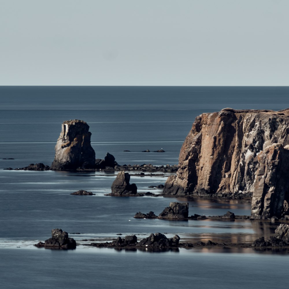 rock mountain near ocean