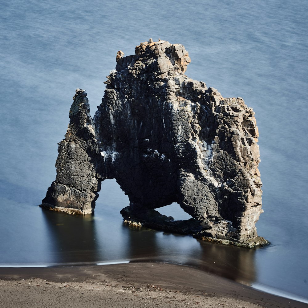 aerial photo of rock formation near seashore