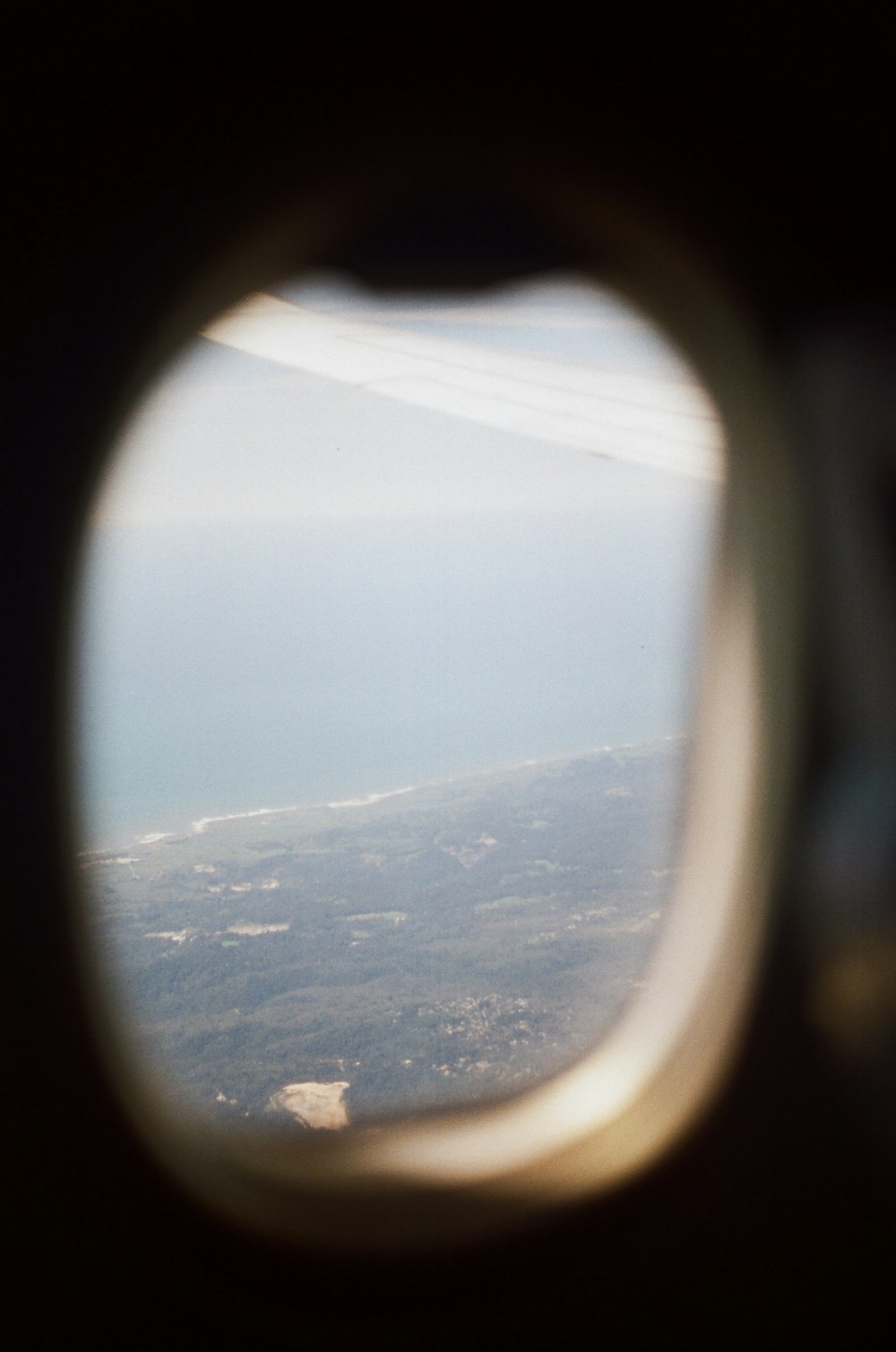 round gray airplane window