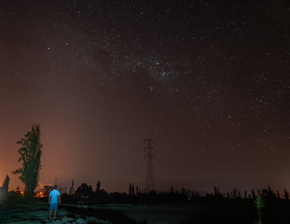 man standing near tree