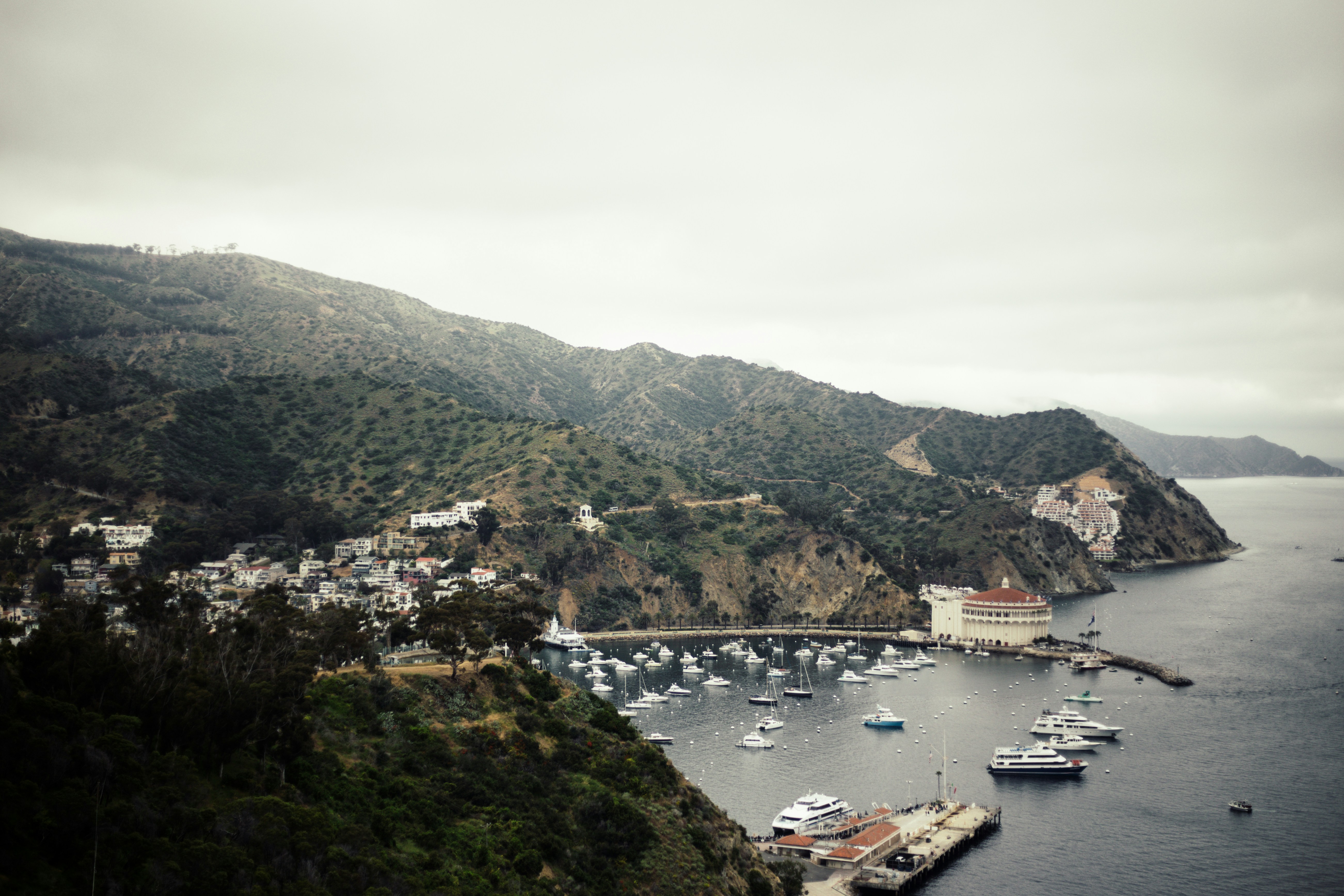 white boats near mountain