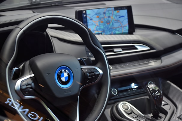shallow focus photo of black BMW steering wheel
