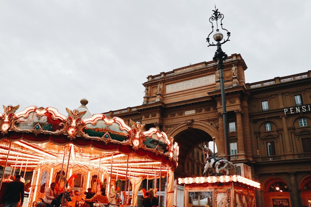 people riding carousel