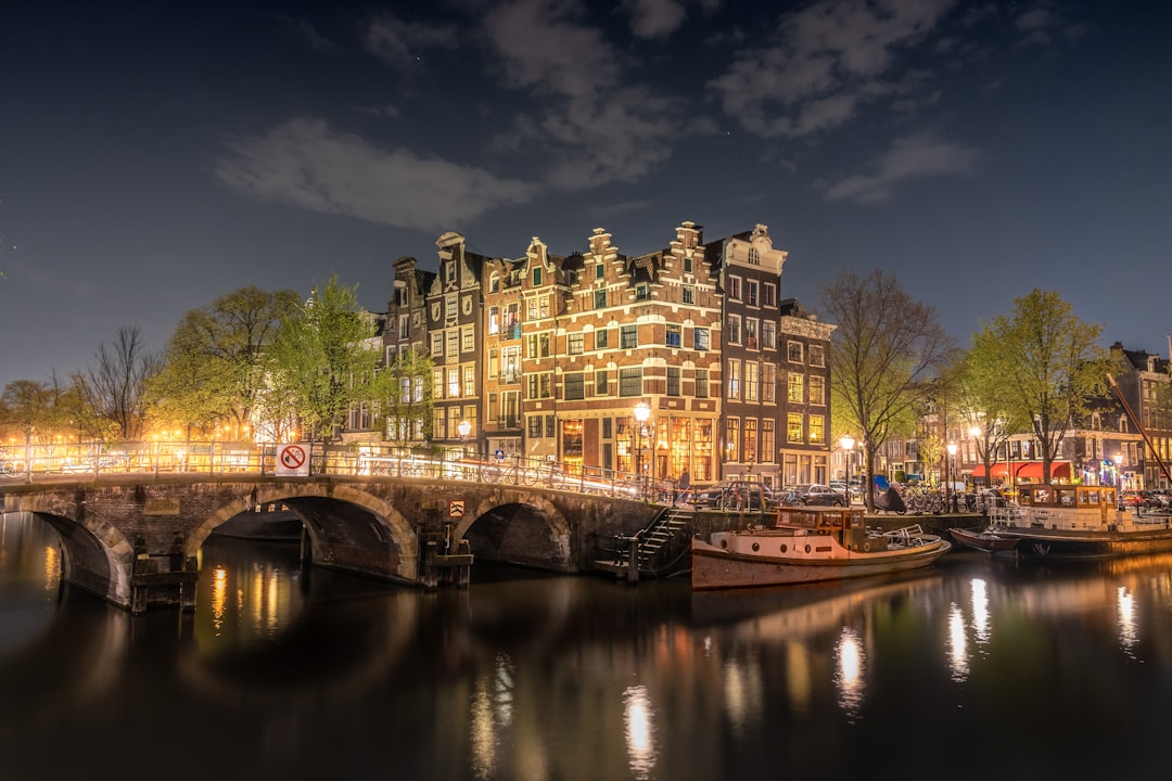 yellow lighted house, Papiermolensluis in-between the Amsterdam canals (c)Reva Group ApS