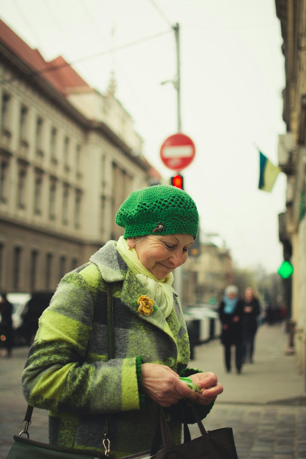 smiling woman wearing green cap