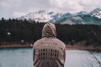 A cozy hoodie displayed in a serene outdoor setting.