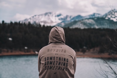 A cozy hoodie displayed in a serene outdoor setting.