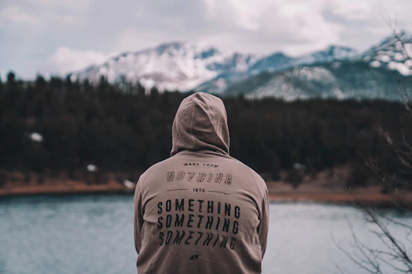 Soft sweatshirt with a mountain silhouette and river graphic reflecting PNW landscapes.