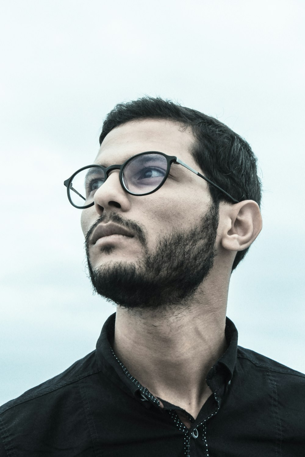 man wearing black frame sunglasses