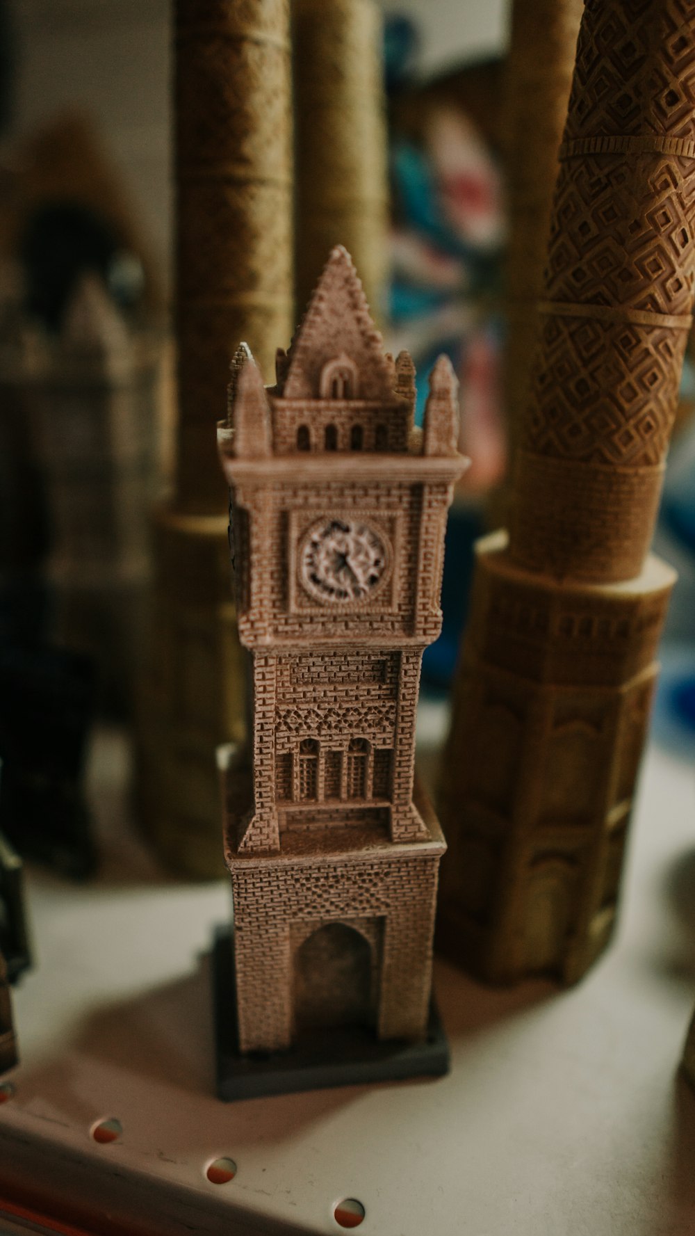 brown tower with clock miniature