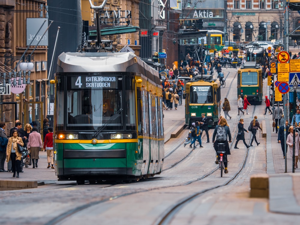green and yellow city tram