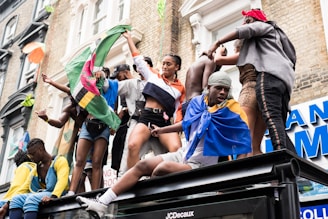 people standing on top of truck