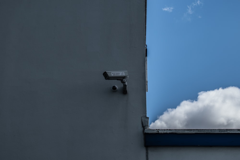 gray outdoor security camera of building