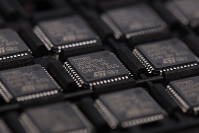 Rows of advanced semiconductor chips neatly arranged on a production line.