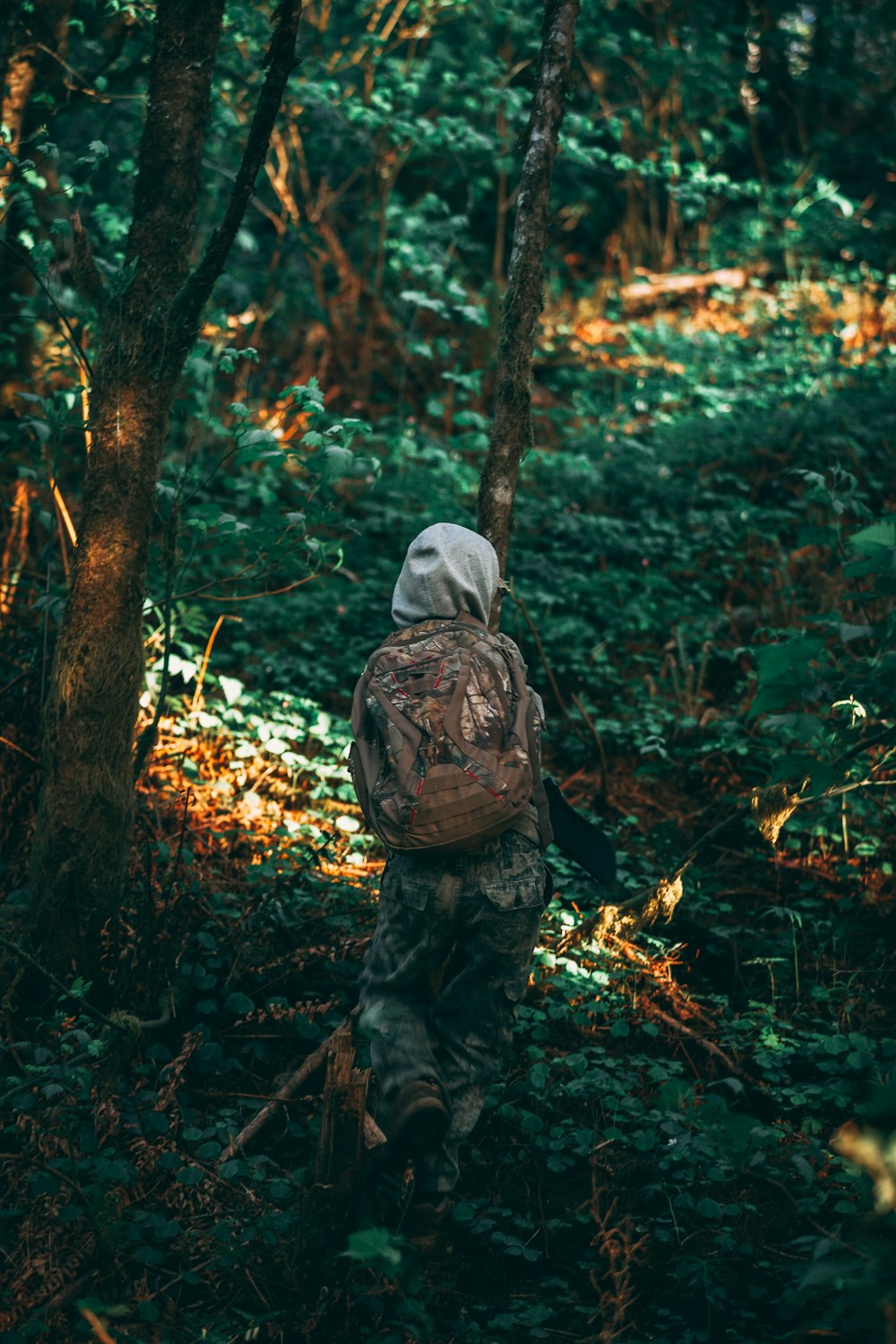 person carrying brown backpack