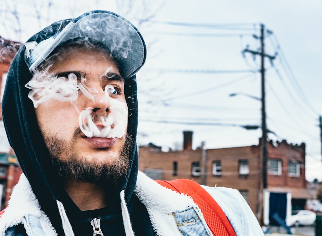 man smoking during daytime