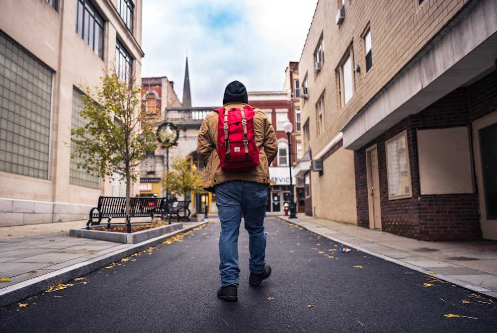 man wearing red backpack