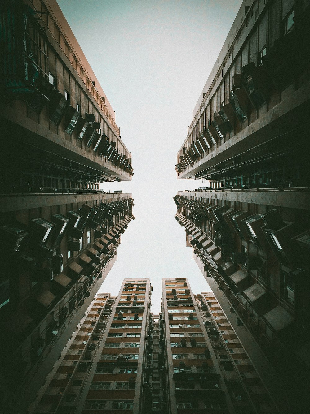 low-angle photo of high rise buildings