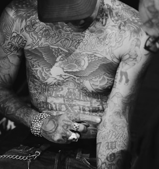 man with assorted body tattoo