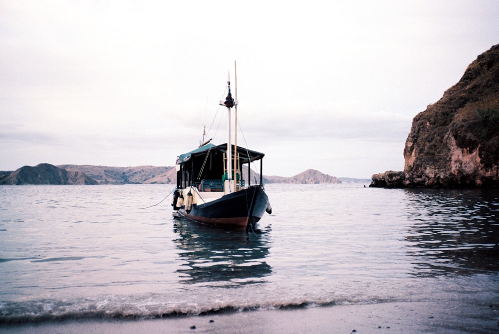 brown boat on sea