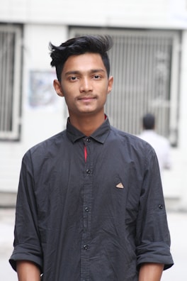 A stylish modern haircut on a young man with a fade and textured top.