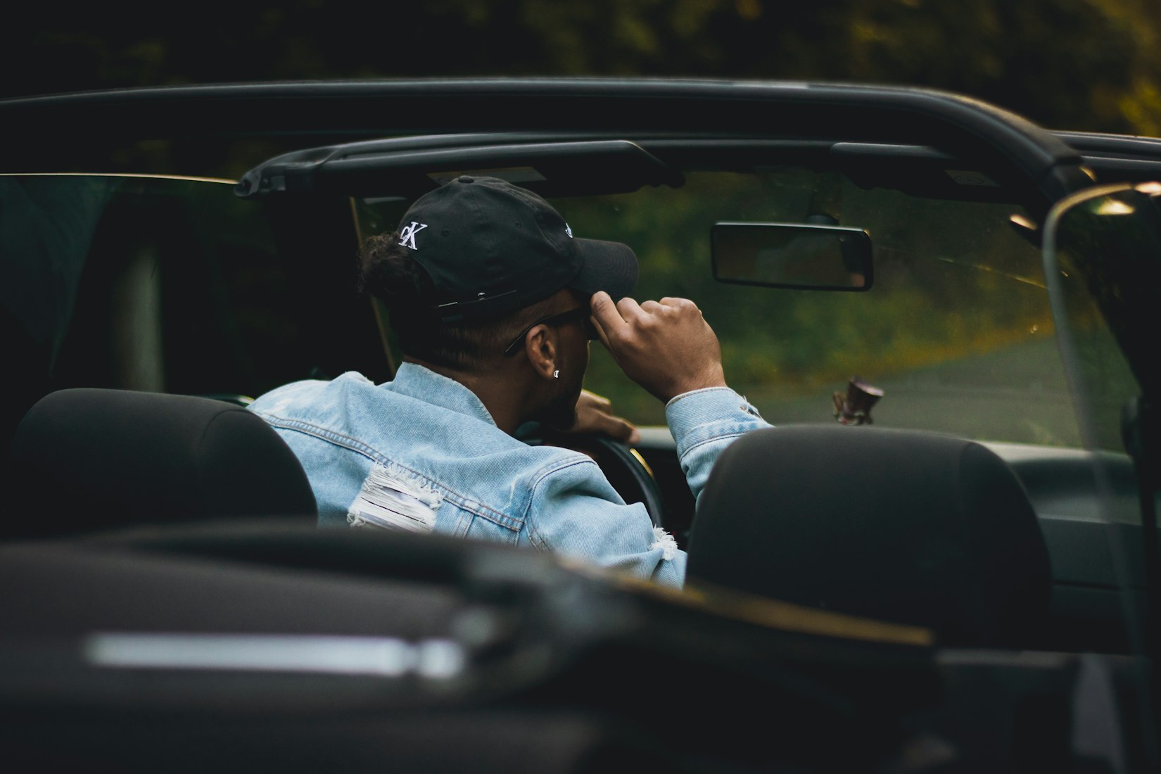 Man driving convertible