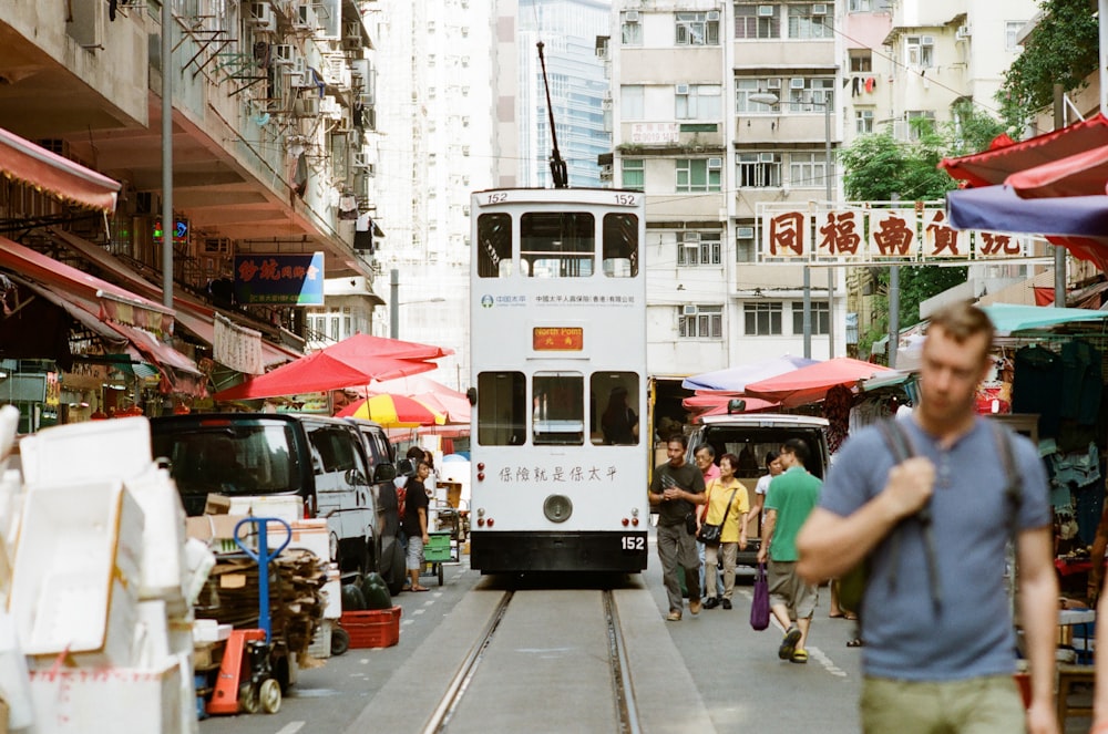 man walking beside train