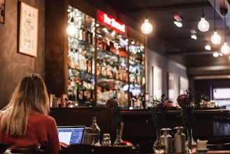 woman facing on laptop inside store