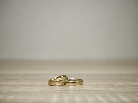 Minimalist ring set arranged artistically on a marble surface.