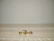 Minimalist shot of vermeil rings stacked neatly on a black velvet surface.