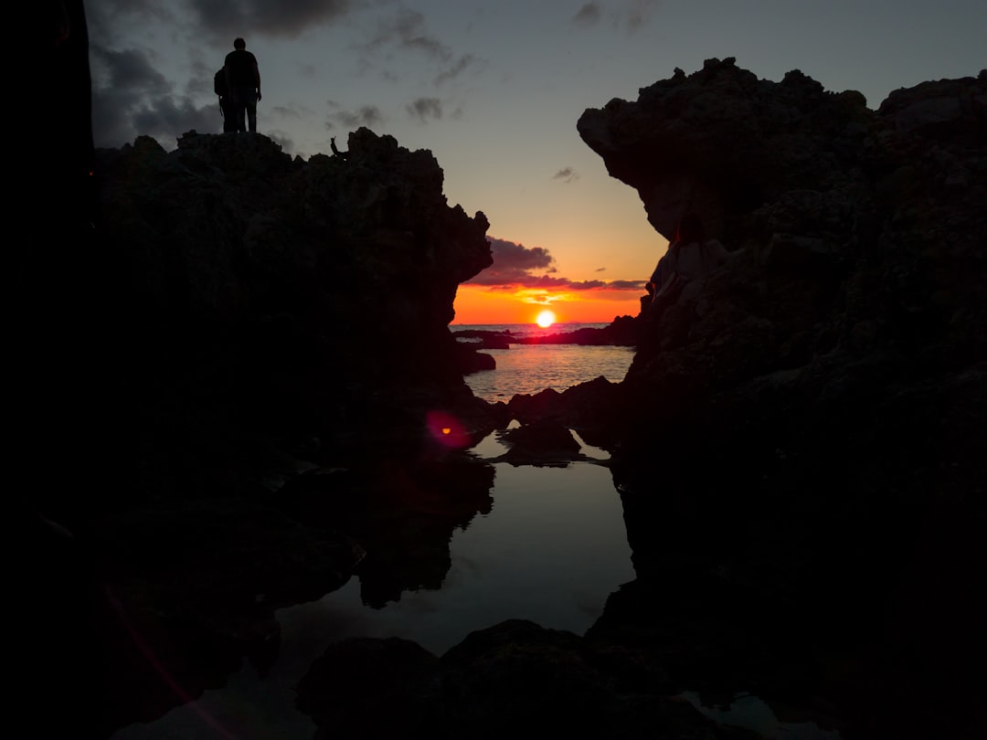 silhouette of man on hill