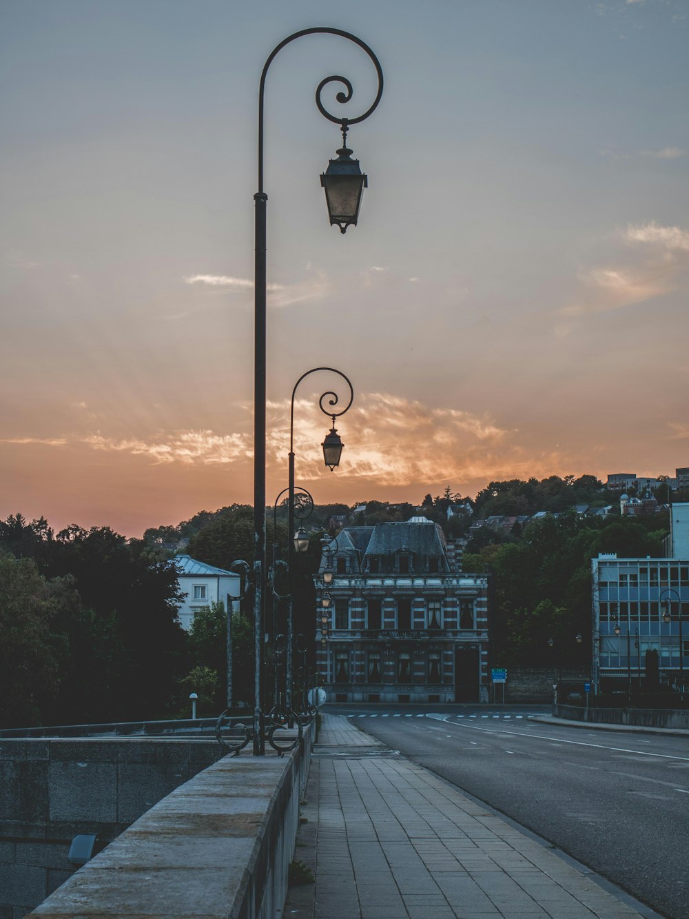 black metal lamp post during golden hour