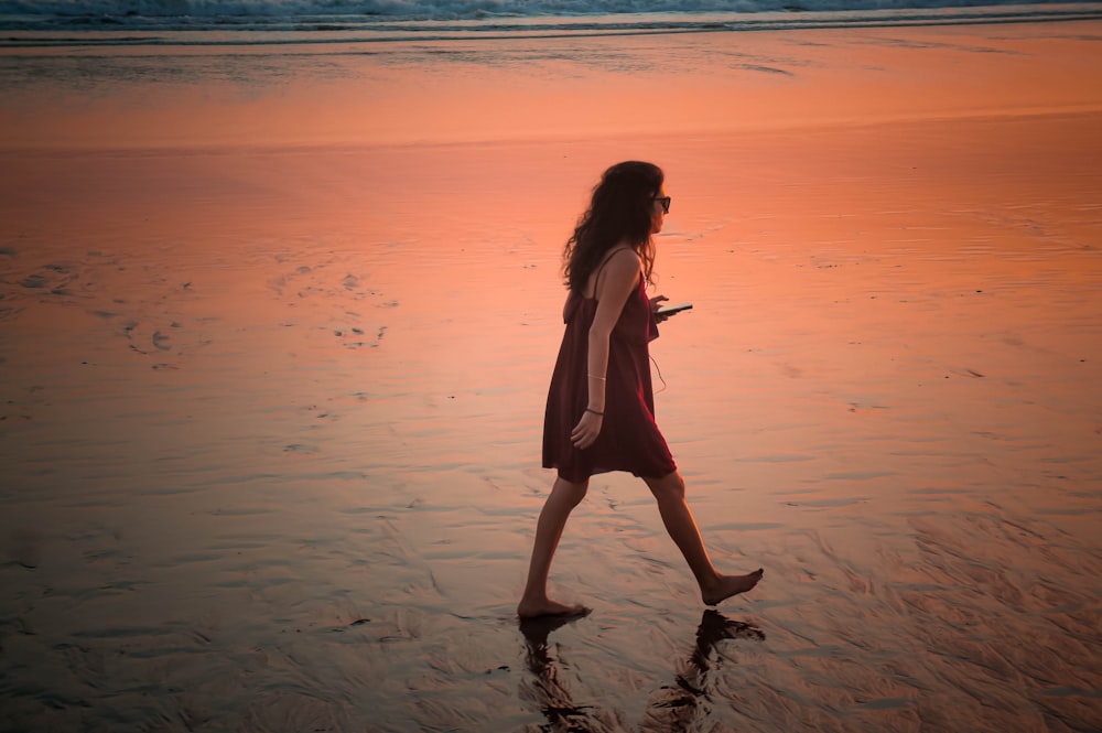 woman walking on seashore