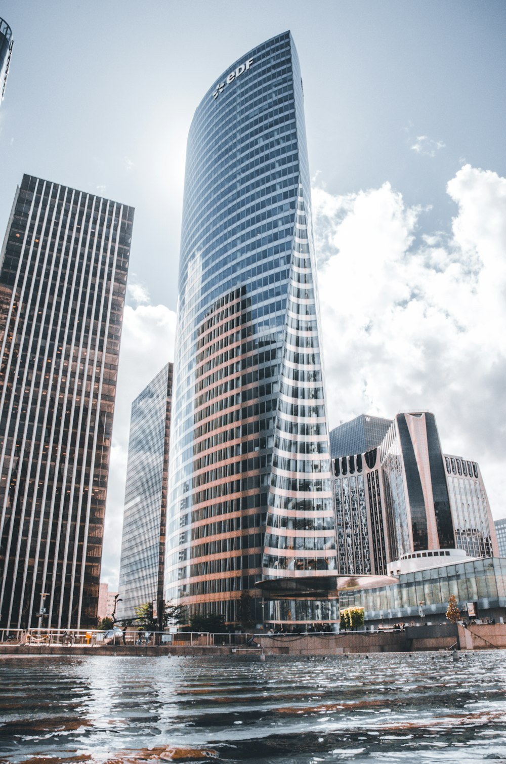 high-rise buildings near body of water during day