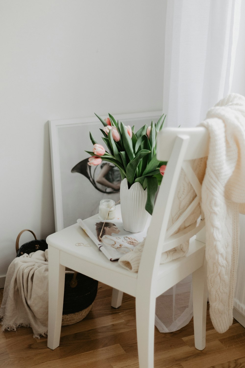 vase of tulips on chair